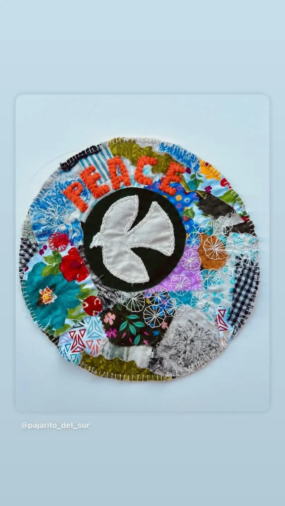 Peace embroidered collage by Susana Vizcarra