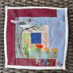 Bird and flowers embroidered collage by Susana Vizcarra